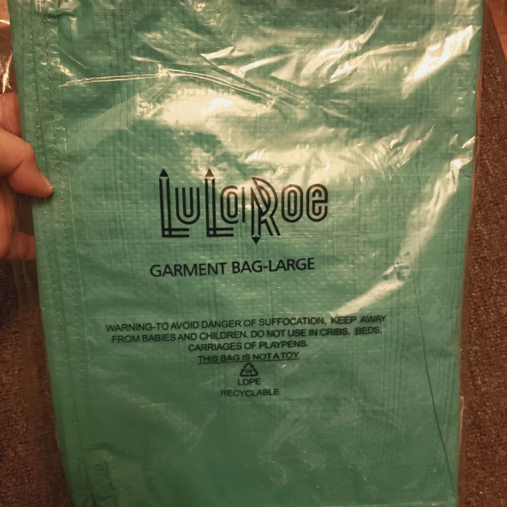 #3 - Garment bag - large. New in package. Never used. Heavy duty material.